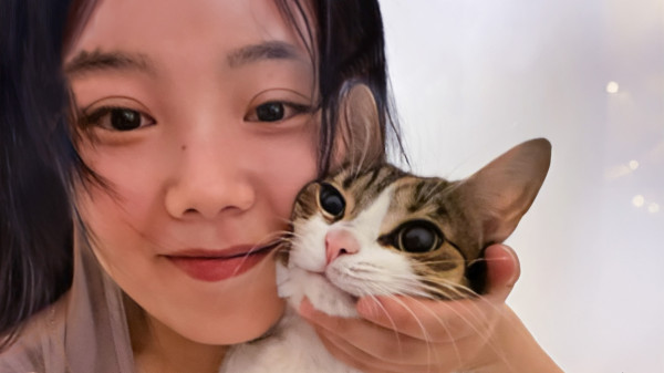 Woman holding her pet cat