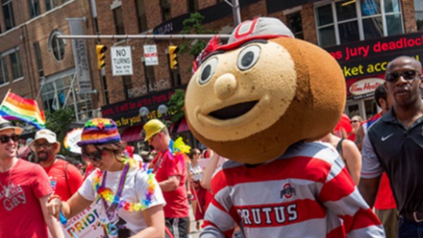 Brutus and students at pride parade