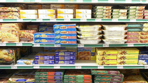 Convinience store shelves full of snack foods