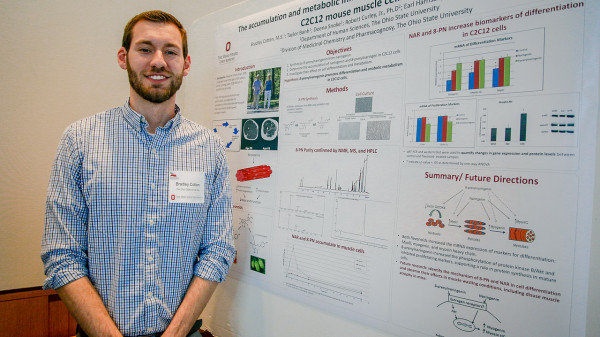 university fellow with research poster