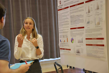 Ohio State student presenting a poster at the research forum