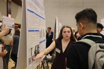 Ohio State students with their research posters presenting at Research Symposium