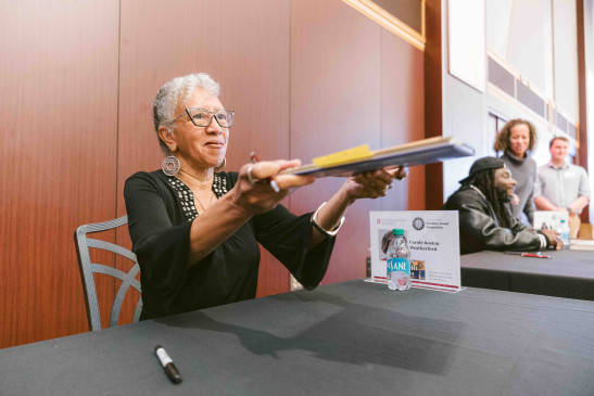 Carol Boston Weatherford signing books at the Newbery Symposium