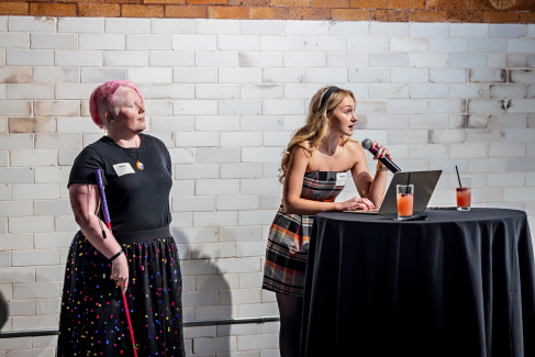 Students welcome guests to the Dining in the Dark and Dim event