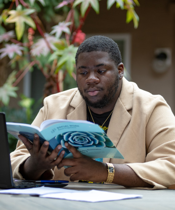 Kenshawn Simmons -- BS in social work 2020; first year grad student in social work, studying in his apartment complex during Coronavirus COVID-19 Pandemic Letters from campus Ohio State Alumni Magazine OSAM Winter 2020 Feature print and digital published