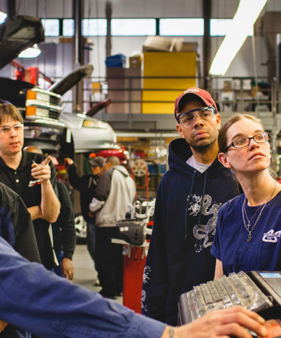 students at auto shop computer