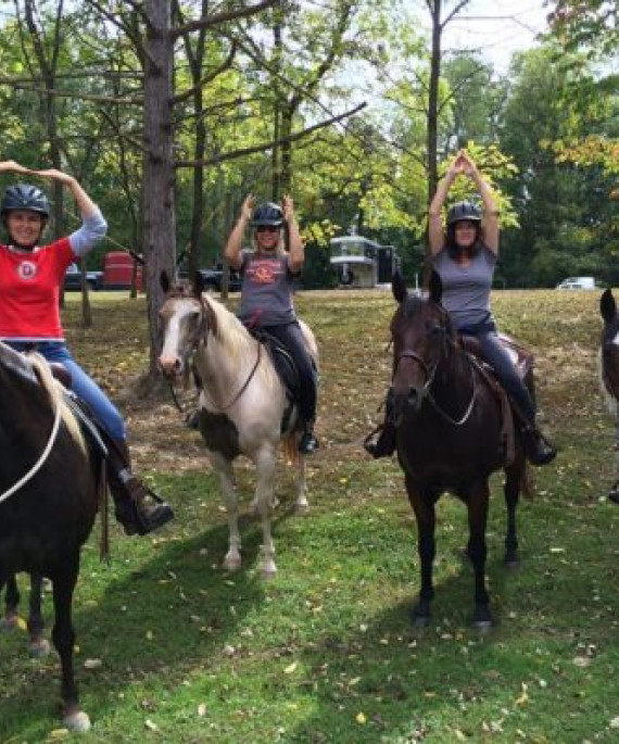 a group of people riding on the backs of horses