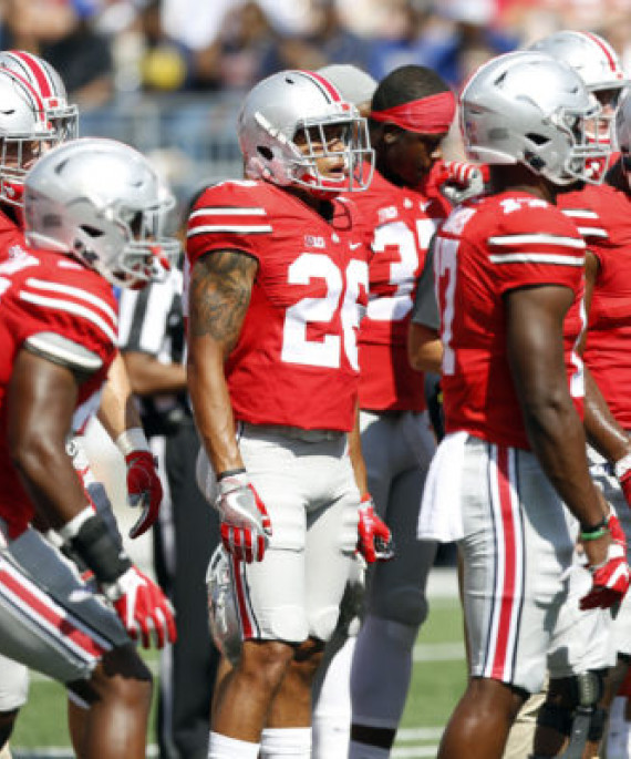 a group of football players standing next to each other