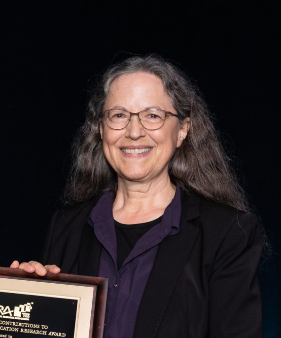 Jackie Blout recieving an award