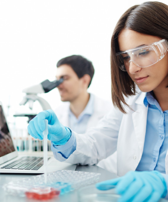 grad students conducting chemical research in lab