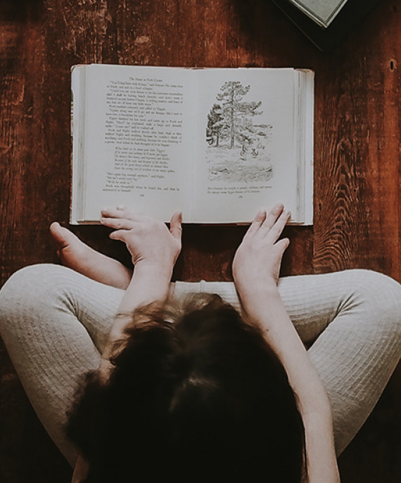 child sitting over book