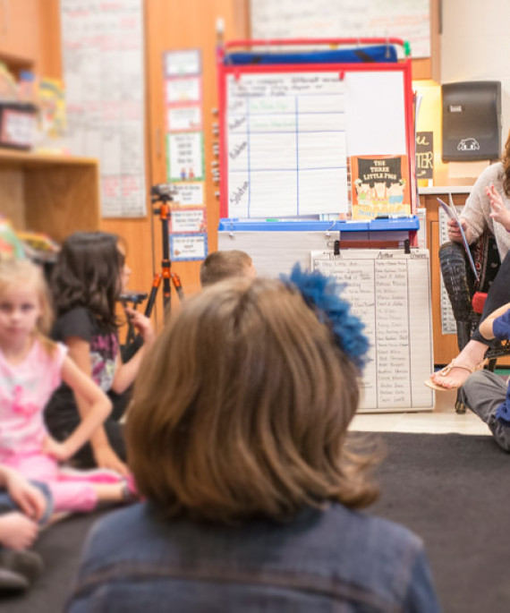 Teacher reading to students in classroom