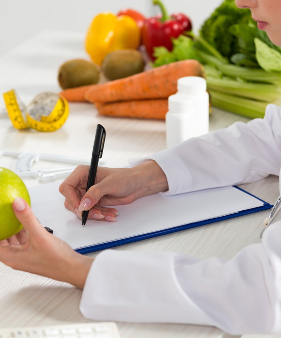 cropped-view-of-dietitian-in-white-coat