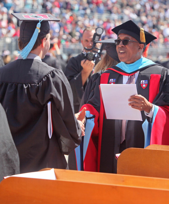 Dean Don Pope-Davis at Ohio State graduation handing out diploma