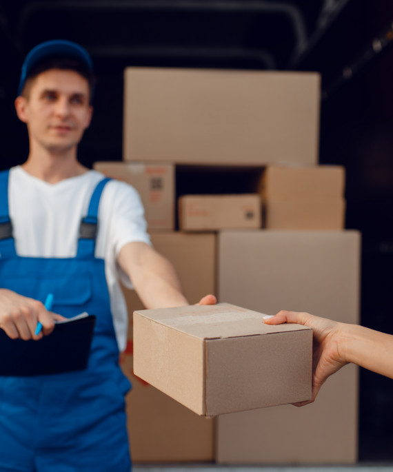 deliveryman-gives-parcel-to-buyer-delivering