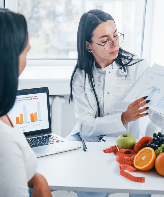 female nutritionist with laptop gives consultation