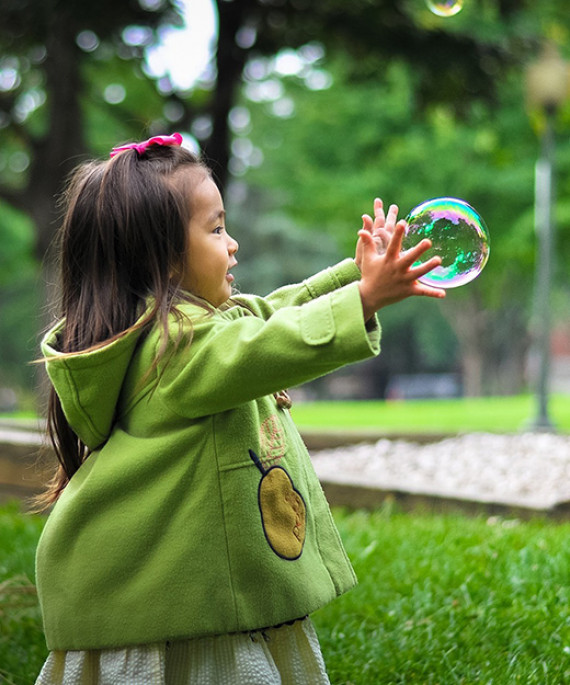 Girl chasing bubble