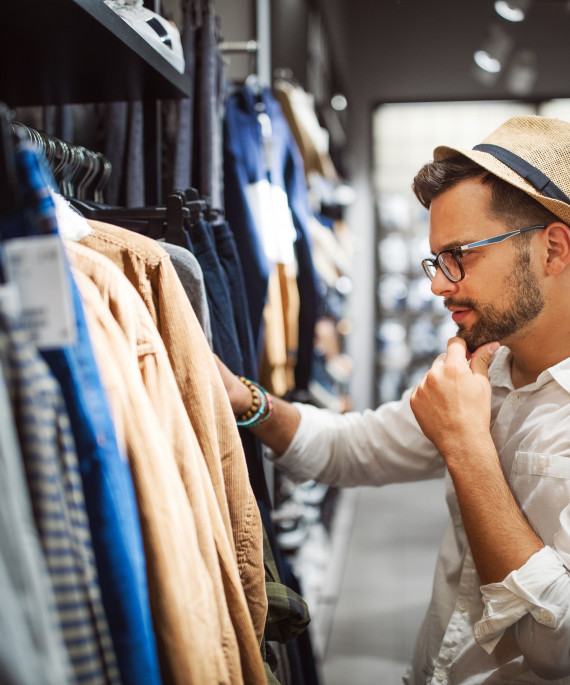 man-shopping-for-new-clothes-in-store