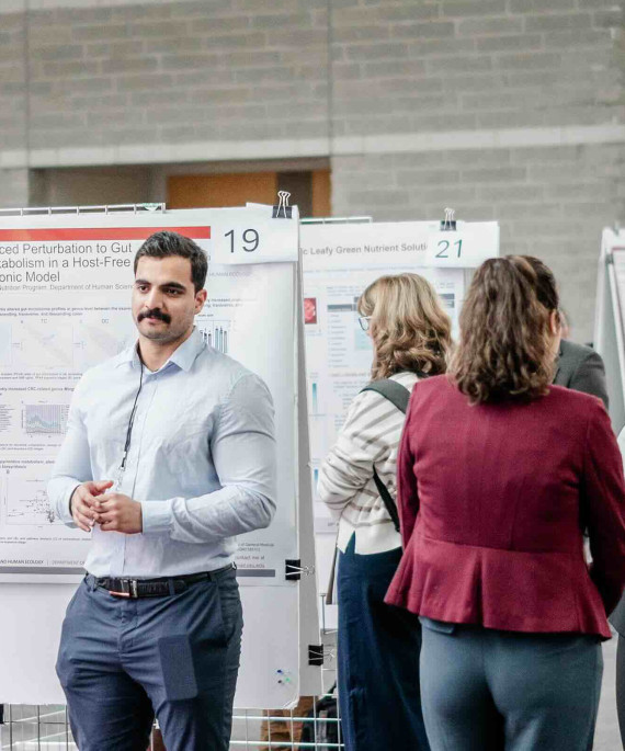Ohio State students with their research posters presenting at Research Symposium