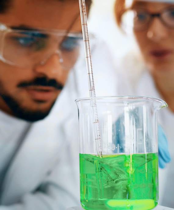 male-student-of-chemistry-working-in-laboratory