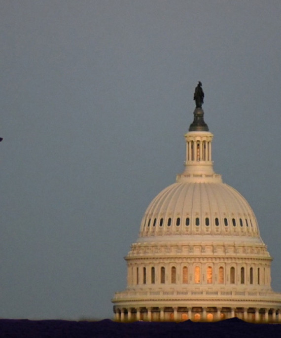 man walling by DC capitol dome