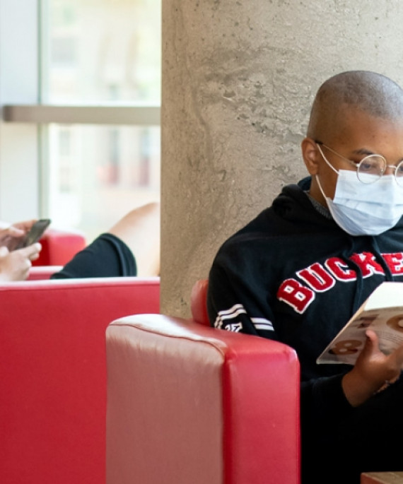 students with masks reading