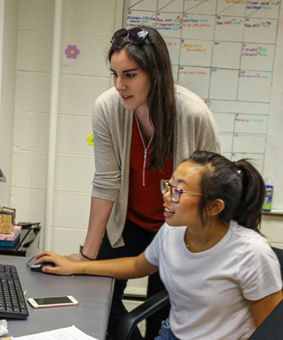 Perez working with student