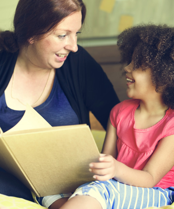 Tutor reading with child