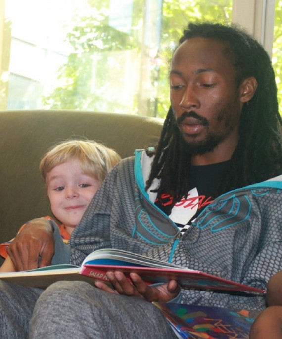 Man reading to preschoolers