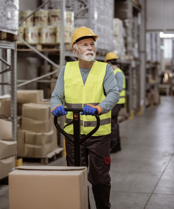 Senior man working in a warehouse