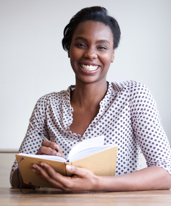 woman writing in journal