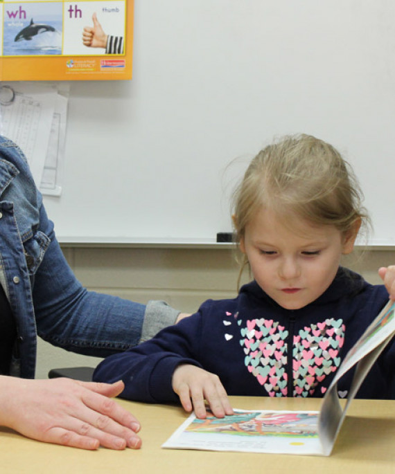 teacher working with student