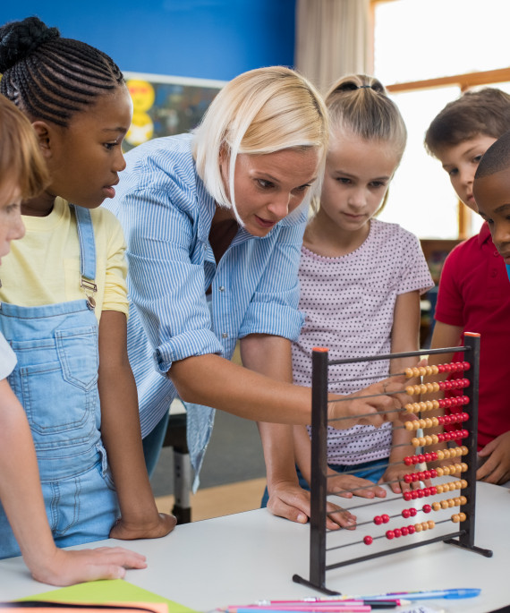 Teacher showing abacust to students