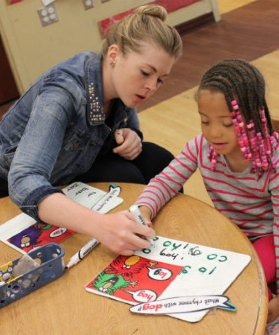 teacher with preschool student