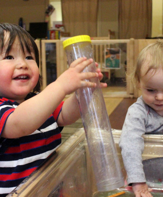 Children playing in a classroom at the Crane Center