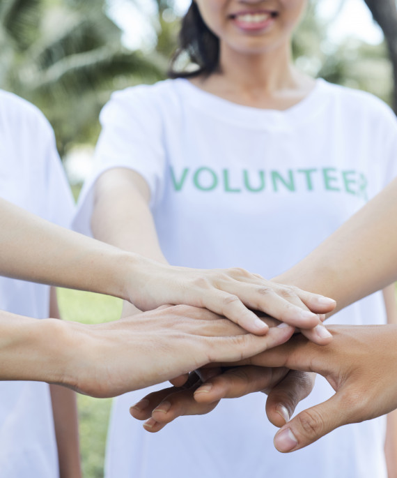 volunteers standing hands