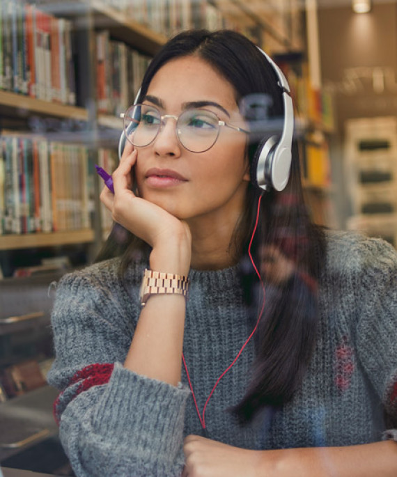 woman studying with headphones on