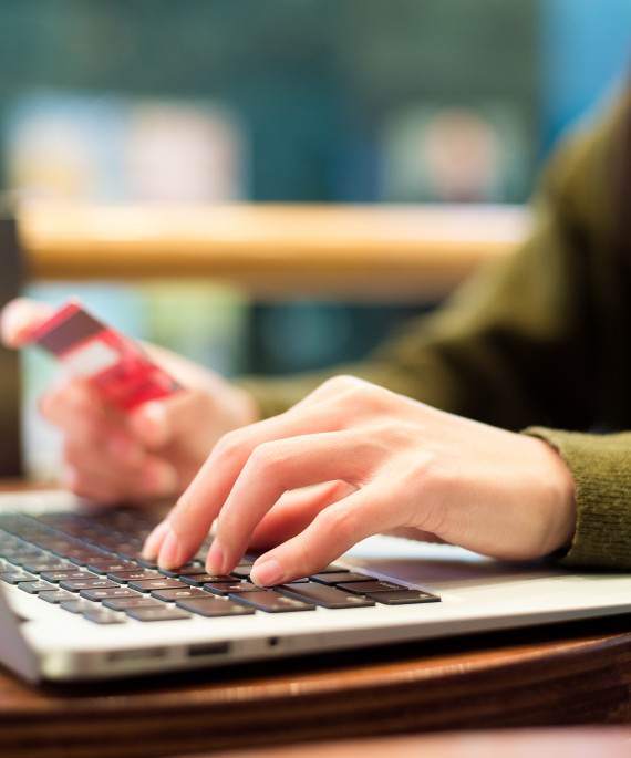 woman using laptop computer for booking ticket