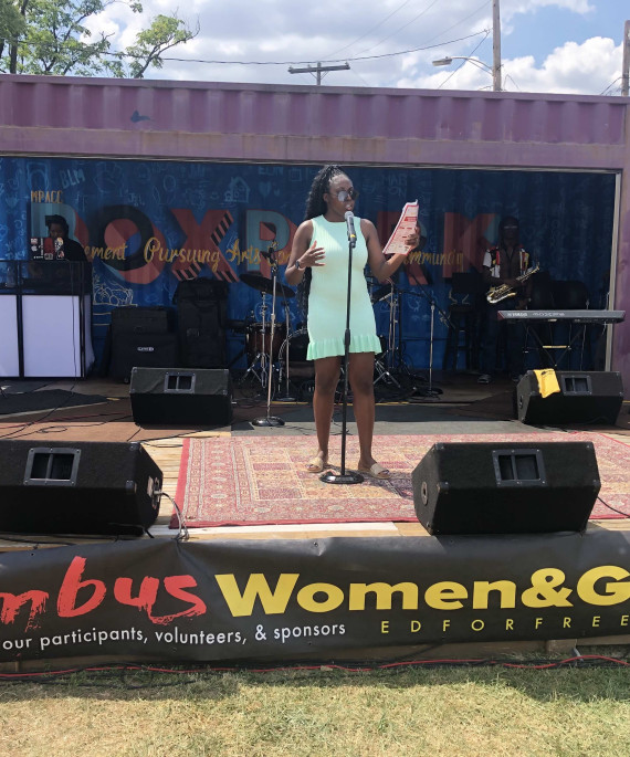 Woman speaking on stage at the Columbus Women & Girls Fest 2024