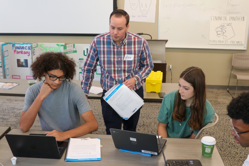 Professional financial planners assist students at the Ohio State cffs summer camp