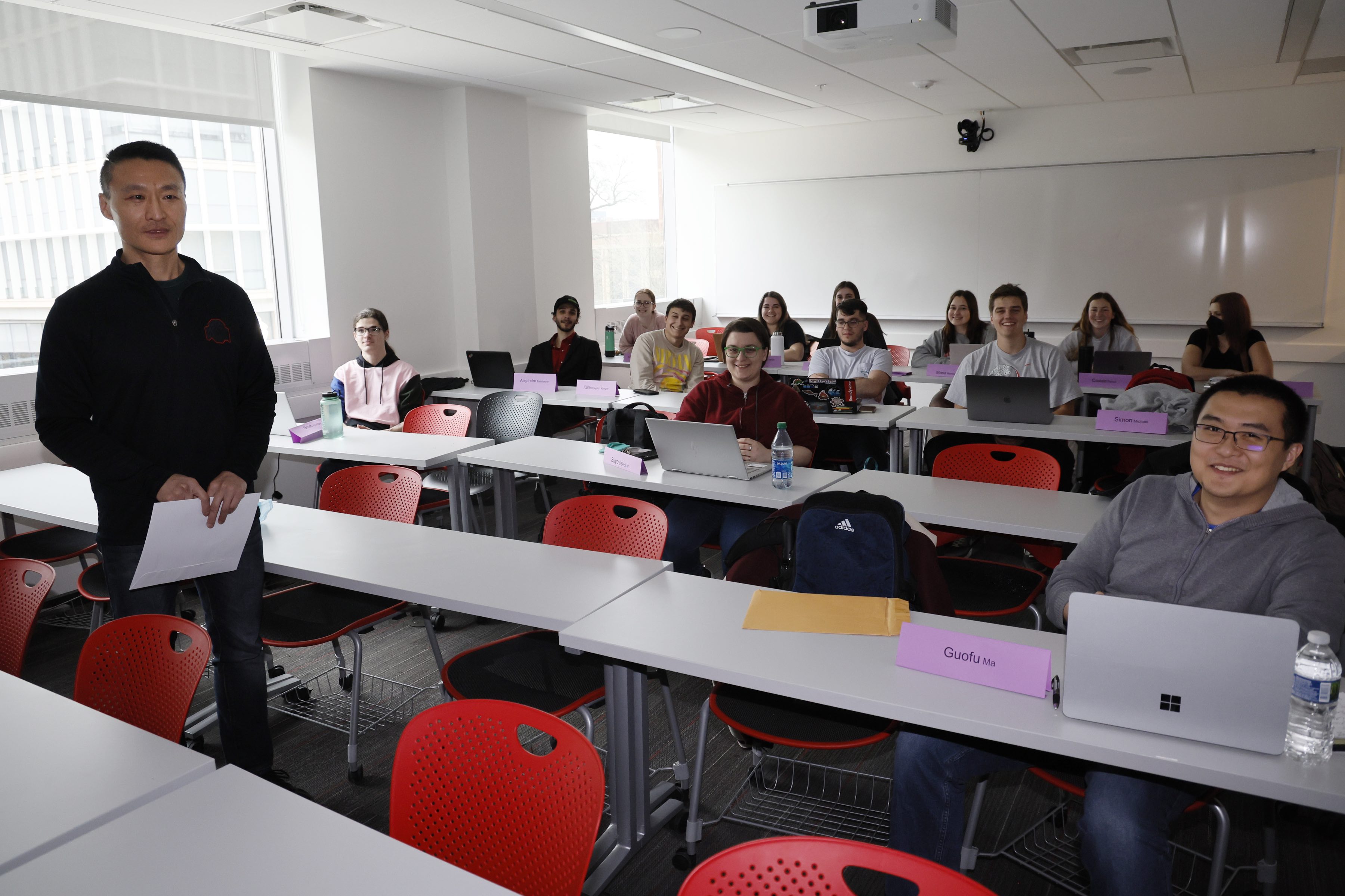 Ohio State professor Lin Ding in classroom with students