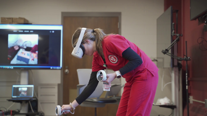 Ohio State nursing student in a VR headset in classroom